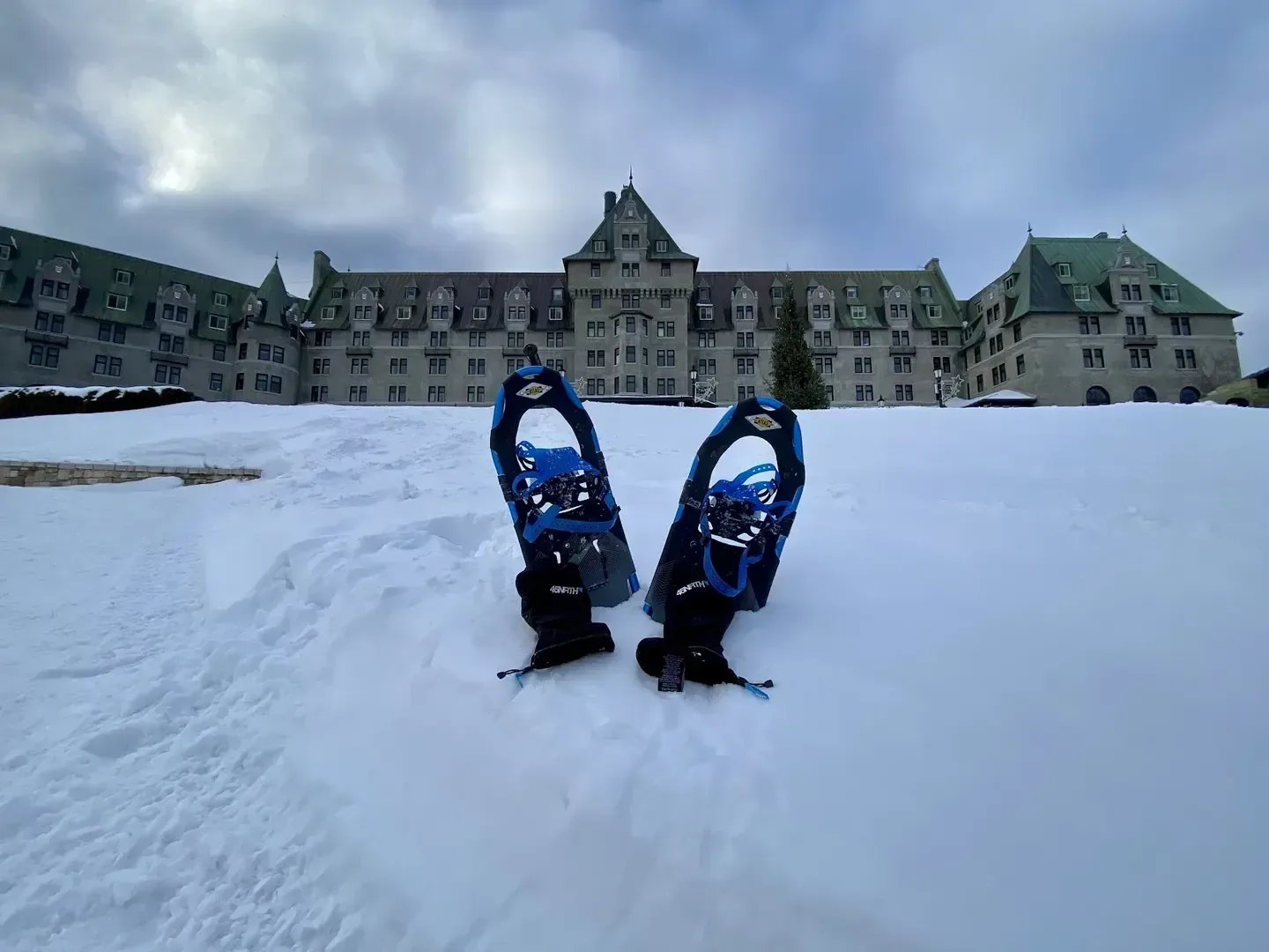 Snow-covered grounds in front of the stone château of Fairmont Le Manoir Richelieu, La Malbaie